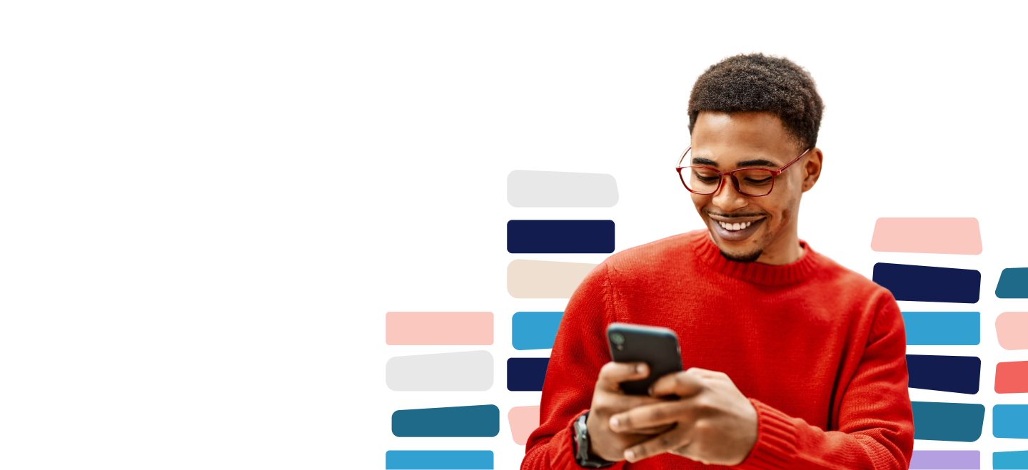 Man smiling looking at phone