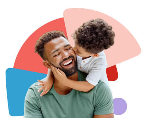 young son with arms around neck of happy father