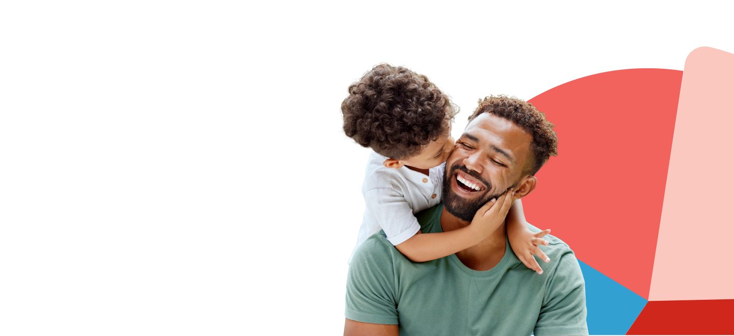 young son with arms around neck of happy father