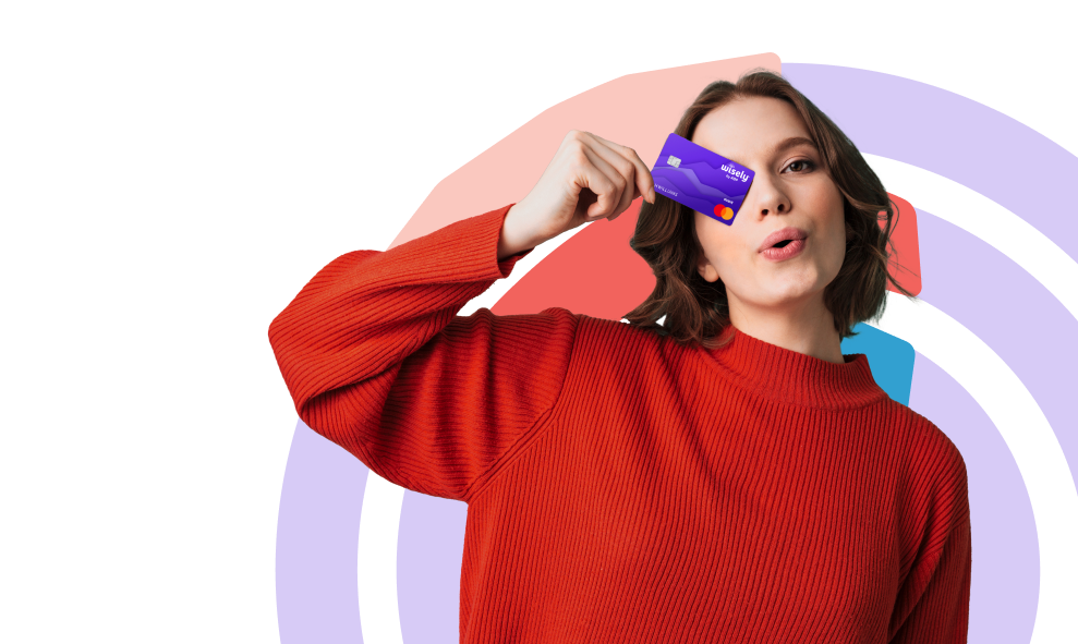 Confident woman holding Wisely card up over her right eye to "See Wisely"