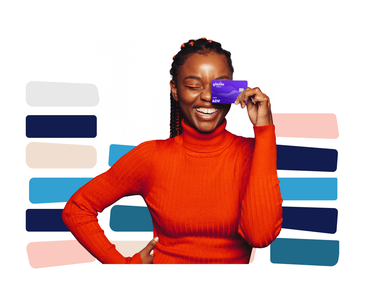 smiling woman holding up a purple wisely card